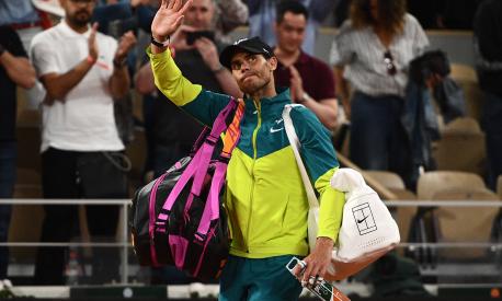 (FILES) Spain's Rafael Nadal waves to the crowd after Germany's Alexander Zverev conceded their men's semi-final singles match on day thirteen of the Roland-Garros Open tennis tournament at the Court Philippe-Chatrier in Paris on June 3, 2022. - Rafael Nadal on May 5 withdrew from the Rome Masters tournament as he continues his recovery from injury, casting serious doubts over his fitness for the French Open. (Photo by Christophe ARCHAMBAULT / AFP)