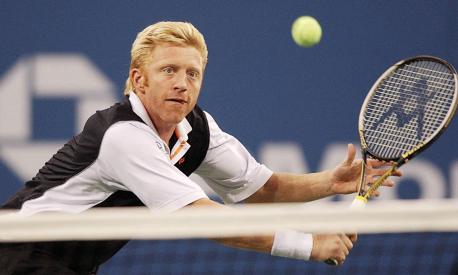 (FILES) In this file photo taken on September 7, 2002 Boris Becker of Germany chases down a backhand from John McEnroe during an exhibition game at the US Open Tennis Tournamen at Flushing Meadows, NY. - Former tennis superstar Boris Becker has been released from prison after serving a sentence relating to his 2017 bankruptcy, British media said on December 16, 2022. The domestic Press Association news agency said the 55-year-old six-time Grand Slam champion will now be deported from the UK, following earlier reports in the German press. (Photo by STAN HONDA / AFP)
