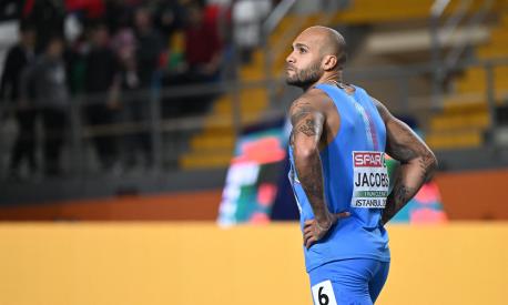 Italy's Lamont Marcell Jacobs looks on after the finals of the men's 60 metres during The European Indoor Athletics Championships at The Atakoy Athletics Arena in Istanbul on March 4, 2023. (Photo by OZAN KOSE / AFP)