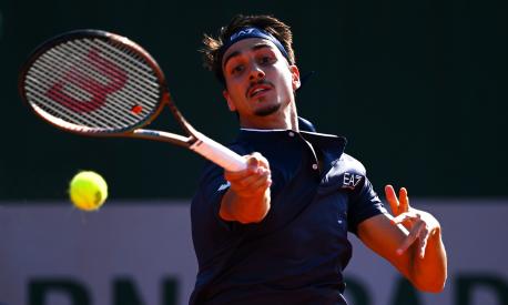 PARIS, FRANCE - MAY 28: Lorenzo Sonego of Italy plays a forehand against Ben Shelton of United States during their Men's Singles First Round match on Day One of the 2023 French Open at Roland Garros on May 28, 2023 in Paris, France. (Photo by Clive Mason/Getty Images)