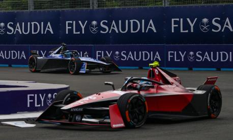 Maserati MSG Racing's Formula E German driver Maximilian Gunther (L) and  Avalanche Andretti's Formula E German driver Andre Lotterer (R) compete in the qualifying of the Formula E race at the Jakarta International e-Prix Circuit in Jakarta on June 3, 2023. (Photo by BAY ISMOYO / AFP)