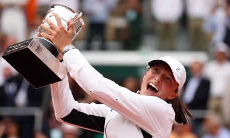 PARIS, FRANCE - JUNE 10: Iga Swiatek of Poland celebrates with her winners trophy after victory against Karolina Muchova of Czech Republic in the Women's Singles Final match on Day Fourteen of the 2023 French Open at Roland Garros on June 10, 2023 in Paris, France. (Photo by Julian Finney/Getty Images)