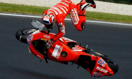 PHILLIP ISLAND, VICTORIA - OCTOBER 13:  Casey Stoner of Australia and the Ducati Team crashes during free practice for the 2007 Australian Motorcycle Grand Prix at the Phillip Island Circuit on October 13, 2007 in Phillip Island, Australia.  (Photo by Andrew Northcott/Getty Images)