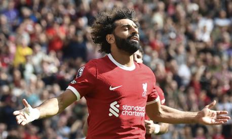 Liverpool's Mohamed Salah celebrates after scoring his sides second goal during the Premier League soccer match between Liverpool and AFC Bournemouth at Anfield, in Liverpool, England, Saturday, Aug. 19, 2023. (AP Photo/Rui Vieira)