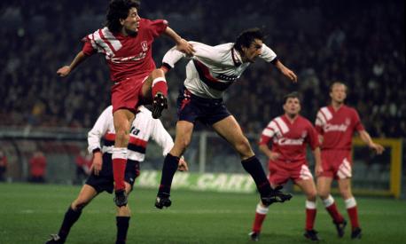 Liverpool's Dean Saunders jumps for the ball, watched by team mates Ray Houghton, second right, and Mark Wright, during the UEFA Cup Fourth Round match against Genoa.  (Photo by Neal Simpson - PA Images via Getty Images)