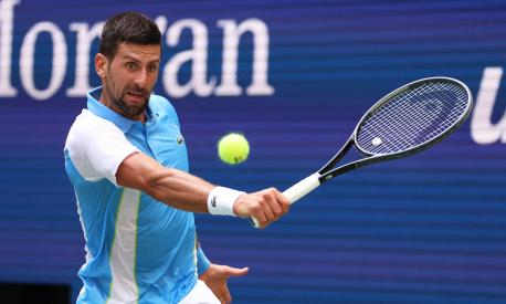 NEW YORK, NEW YORK - AUGUST 30: Novak Djokovic of Serbia plays a backhand against Bernabe Zapata Miralles of Spain during their Men's Singles Second Round match on Day Two of the 2023 US Open at the USTA Billie Jean King National Tennis Center on August 30, 2023 in the Flushing neighborhood of the Queens borough of New York City.   Clive Brunskill/Getty Images/AFP (Photo by CLIVE BRUNSKILL / GETTY IMAGES NORTH AMERICA / Getty Images via AFP)