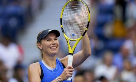 Caroline Wozniacki, of Denmark, waves to fans after defeating Jennifer Brady, of the United States, during the third round of the U.S. Open tennis championships, Friday, Sept. 1, 2023, in New York. (AP Photo/Manu Fernandez)