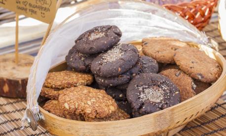 Delicious carob cookies and whole biscuits in a handmade products bazaar, Ibiza, Spain.