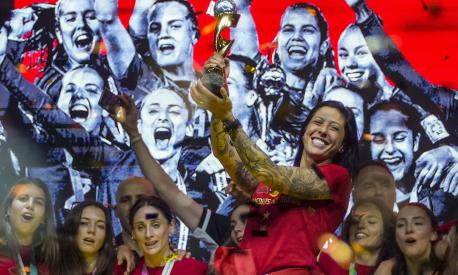 FILE - Spain's Jennifer Hermoso holds the trophy as they celebrate their Women's World Cup victory on stage in Madrid, Spain, Monday, Aug. 21, 2023. Spanish state prosecutors say soccer player Jenni Hermoso has accused Luis Rubiales of sexual assault for kissing her on the lips without her consent after the Women's World Cup final. (AP Photo/Manu Fernandez, File)