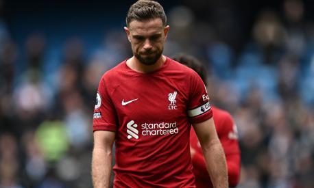 Liverpool's English midfielder Jordan Henderson reacts to their defeat on the pitch after the English Premier League football match between Manchester City and Liverpool at the Etihad Stadium in Manchester, north west England, on April 1, 2023. - Manchester City won the game 4-1. (Photo by Paul ELLIS / AFP) / RESTRICTED TO EDITORIAL USE. No use with unauthorized audio, video, data, fixture lists, club/league logos or 'live' services. Online in-match use limited to 120 images. An additional 40 images may be used in extra time. No video emulation. Social media in-match use limited to 120 images. An additional 40 images may be used in extra time. No use in betting publications, games or single club/league/player publications. /