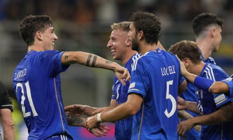 Italy's Davide Frattesi, second from left, celebrates with his teammates after scoring against Ukraine during the Euro 2024 group C qualifying soccer match between Italy and Ukraine at San Siro Stadium, in Milan, Italy, Tuesday, Sept.12, 2023. (AP Photo/Antonio Calanni)