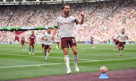 LONDON, ENGLAND - SEPTEMBER 16: Bernardo Silva of Manchester City celebrates after scoring their sides second goal during the Premier League match between West Ham United and Manchester City at London Stadium on September 16, 2023 in London, England. (Photo by Justin Setterfield/Getty Images)