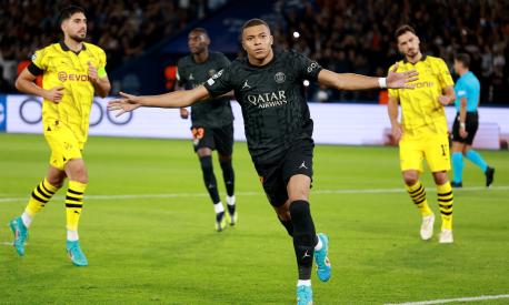 PARIS, FRANCE - SEPTEMBER 19: Kylian Mbappe of Paris Saint-Germain celebrates after scoring the team's first goal from the penalty spot during the UEFA Champions League Group F match between Paris Saint-Germain and Borussia Dortmund at Parc des Princes on September 19, 2023 in Paris, France. (Photo by Johannes Simon/Getty Images)