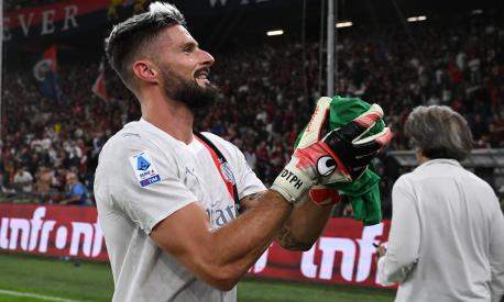 GENOA, ITALY - OCTOBER 07: Olivier Giroud of AC Milan celebrates the victory with his team-mates playing as goalkeeper after Mike Maignan received a red card during the Serie A TIM match between Genoa CFC and AC Milan at Stadio Luigi Ferraris on October 07, 2023 in Genoa, Italy. (Photo by Claudio Villa/AC Milan via Getty Images)