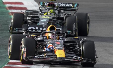 Red Bull driver Max Verstappen, of the Netherlands, is chased closely by Mercedes driver Lewis Hamilton, of Britain, during the sprint ahead of the Formula One U.S. Grand Prix auto race at Circuit of the Americas, Saturday, Oct. 21, 2023, in Austin, Texas. (AP Photo/Nick Didlick)