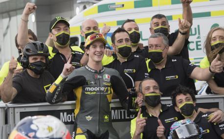 DOHA, QATAR - MARCH 05: Celestino Vietti Ramus of Italy and Mooney VR46 Racing Team   celebrates the pole position with team  at the end of the Moto2 qualifying practice during the MotoGP of Qatar - Qualifying at Losail Circuit on March 05, 2022 in Doha, Qatar. (Photo by Mirco Lazzari gp/Getty Images,)