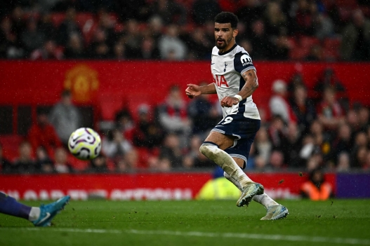 Tottenham Hotspur's English striker #19 Dominic Solanke shoots but has the shot saved during the English Premier League football match between Manchester United and Tottenham Hotspur at Old Trafford in Manchester, north west England, on September 29, 2024. (Photo by Paul ELLIS / AFP) / RESTRICTED TO EDITORIAL USE. No use with unauthorized audio, video, data, fixture lists, club/league logos or 'live' services. Online in-match use limited to 120 images. An additional 40 images may be used in extra time. No video emulation. Social media in-match use limited to 120 images. An additional 40 images may be used in extra time. No use in betting publications, games or single club/league/player publications. /
