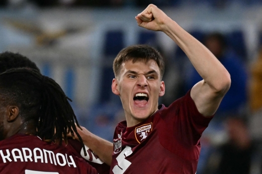 Torino's Lithuanian midfielder #66 Gvidas Gineitis (R) celebrates with teammates after scoring Torino's first goal during the Italian Serie A football match between Lazio and Torino at the Olympic Stadium in Rome on March 31, 2025. (Photo by Filippo MONTEFORTE / AFP)