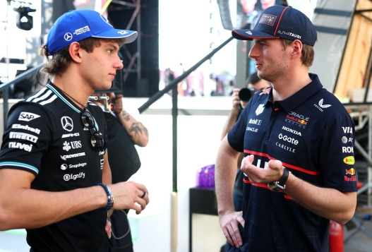  Andrea Kimi Antonelli of Italy and Mercedes AMG Petronas F1 Team and Max Verstappen of the Netherlands and Oracle Red Bull Racing talk behind the fan stage prior to the Sprint ahead of the F1 Grand Prix of Qatar at Lusail International Circuit on November 29, 2025 in Lusail City, Qatar. (Photo by Mark Thompson/Getty Images)