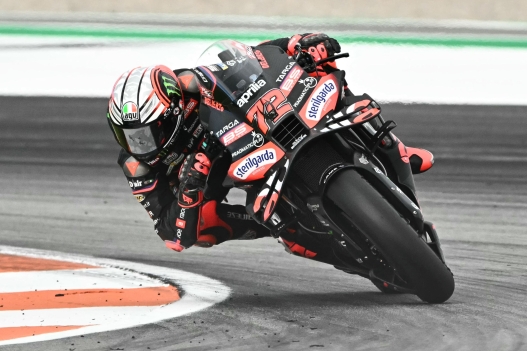 Aprilia Racing team's Italian MotoGP rider Marco Bezzecchi competes in the MotoGP race of the Valencia Grand Prix at the Ricardo Tormo racetrack in Cheste on November 16, 2025. (Photo by JOSE JORDAN / AFP)