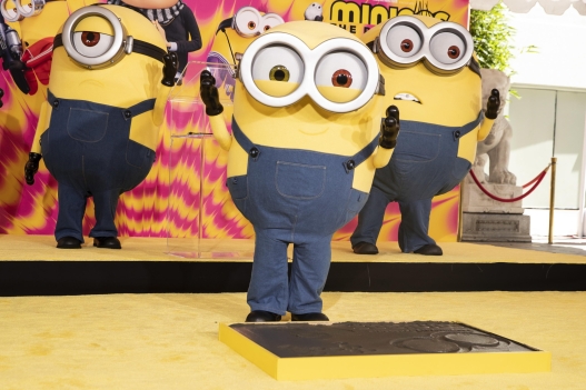 epa10032648 A Bob the Minion character poses during the hand and foot prints ceremony celebrating the 'Minions' at the TCL Chinese Theater in Hollywood, California, USA, 24 June 2022. EPA/ETIENNE LAURENT