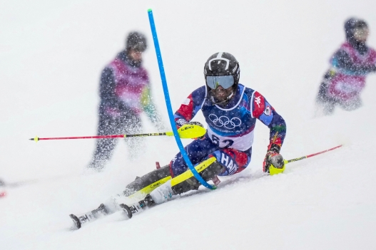 TOPSHOT - Haiti's Richardson Viano competes in the first run of the men's slalom alpine skiing event during the Milano Cortina 2026 Winter Olympic Games at the Stelvio Ski Centre in Bormio (Valtellina) on February 16, 2026. (Photo by Dimitar DILKOFF / AFP)