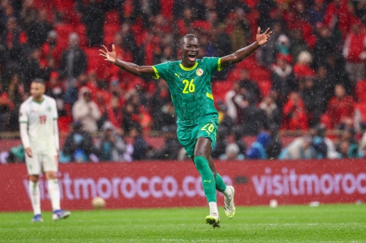 Senegal's midfielder #26 Pape Gueye celebrates their victory at the end of the Africa Cup of Nations (CAN) final football match between Senegal and Morocco at the Prince Moulay Abdellah Stadium in Rabat on January 18, 2026. (Photo by FRANCK FIFE / AFP)