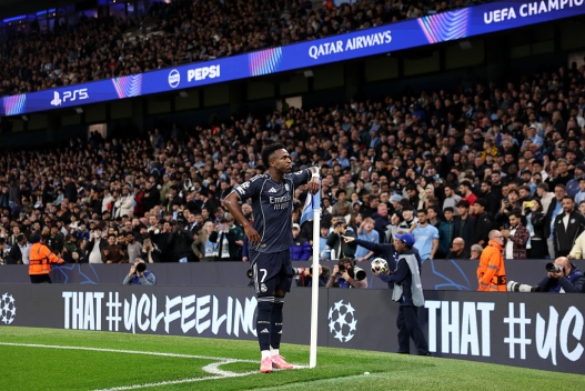  Vinicius Junior of Real Madrid celebrates scoring his team's first goal from the penalty spot during the UEFA Champions League 2025/26 Round of 16 Second Leg match between Manchester City FC and Real Madrid CF at City of Manchester Stadium on March 17, 2026 in Manchester, England. (Photo by Carl Recine/Getty Images)