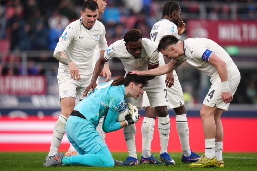 LazioÕs Edoardo Motta receives compliments from his teammates after saving a penalty kick during the Serie A soccer match between Bologna and Lazio at the Renato DallÕAra Stadium in Bologna, north Italy - Sunday, March 22, 2026 - (Photo by Massimo Paolone/LaPresse)