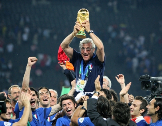 Italian national coach Marcello Lippi celebrates with the World Cup Trophy in his hands at the end of the final of the 2006 FIFA World Cup between Italy and France at the Olympic Stadium in Berlin, Germany, Sunday 09 July 2006. ANSA