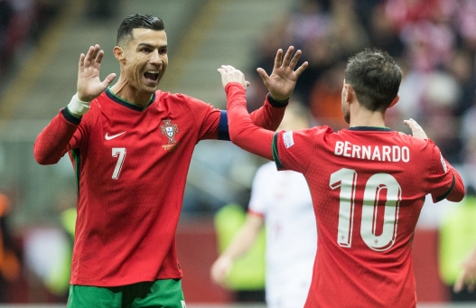 Cristiano Ronaldo , Bernardo Silva , goal celebration during UEFA Nations League match Poland vs Portugal in Warsaw Poland on 12 October 2024. (Photo by Foto Olimpik/NurPhoto) (Photo by Foto Olimpik / NurPhoto via AFP)