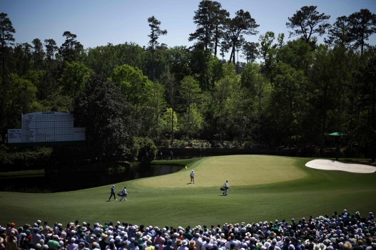  Ludvig Aberg of Sweden and Scottie Scheffler of the United States walk to the 11th green during the third round of the 2026 Masters Tournament at Augusta National Golf Club on April 11, 2026 in Augusta, Georgia.   Jared C. Tilton/Getty Images/AFP (Photo by Jared C. Tilton / GETTY IMAGES NORTH AMERICA / Getty Images via AFP)