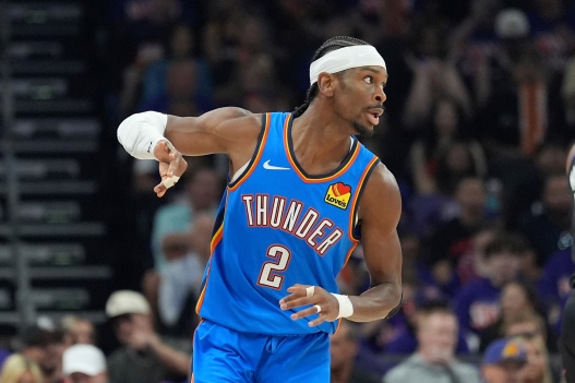 Oklahoma City Thunder guard Shai Gilgeous-Alexander celebrates a 3-pointer against the Phoenix Suns during the first half of Game 3 of a first-round NBA playoffs basketball series, Saturday, April 25, 2026, in Phoenix. (AP Photo/Ross D. Franklin)