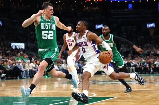 BOSTON, MASSACHUSETTS - MAY 02: Tyrese Maxey #0 of the Philadelphia 76ers drives around Luka Garza #52 of the Boston Celtics during the second quarter in Game Seven of the First Round of the NBA Eastern Conference Playoffs at TD Garden on May 02, 2026 in Boston, Massachusetts. NOTE TO USER: User expressly acknowledges and agrees that, by downloading and or using this photograph, User is consenting to the terms and conditions of the Getty Images License Agreement. Maddie Meyer/Getty Images/AFP (Photo by Maddie Meyer / GETTY IMAGES NORTH AMERICA / Getty Images via AFP)
