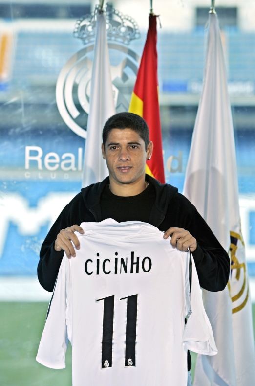 Cicinho of Brazil holds up his new shirt after signing for Spanish soccer club  Real Madrid during his presentation at the Santiago Bernabeu stadium in Madrid Thursday Dec. 29, 2005. Cicinho, who signed a contract for five years, will join Brazilians Ronaldo, Roberto Carlos, Julio Baptista and Robinho in Madrid's star-studded squad. (AP Photo/Paul White)