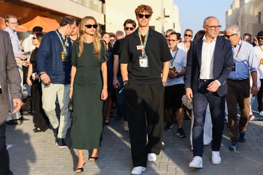 Jannik Sinner and his girlfriend Laila Hasanovic walking in the paddock with Stefano Domenicali ahead Formula 1 Abu Dhabi Grand Prix at Yas Marina Circuit on December 7th, 2025 in Abu Dhabi, United Arab Emirates. (Photo by Beata Zawrzel/NurPhoto) (Photo by Beata Zawrzel / NurPhoto via AFP)