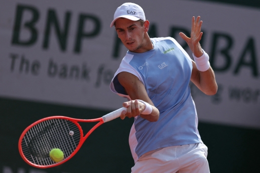 Italy's Matteo Arnaldi plays a forehand return to Belgium's Raphael Collignon during their men's singles match on day 7 of the French Open tennis tournament at the Roland-Garros Complex in Paris on May 30, 2026. (Photo by Thomas SAMSON / AFP)