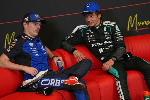 Mercedes driver Andrea Kimi Antonelli of Italy talks with Red Bull driver Max Verstappen of the Netherlands during a news conference after the qualifying session for the Monaco F1 Grand Prix, at the Monaco racetrack, Saturday, June 6, 2026. (AP Photo/Fatima Shbair)