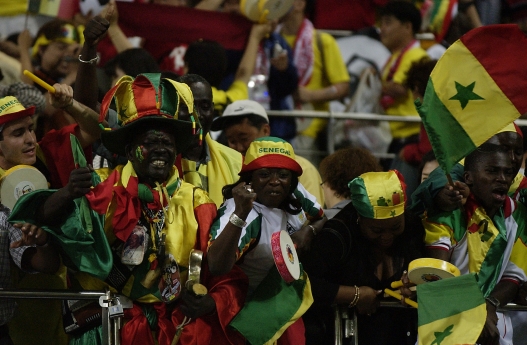   Senegal soccer fans celebrate their 1-0 victory over France during the second half of the France v Senegal Group A, World Cup Group Stage match played at the Seoul World Cup Stadium, Seoul, South Korea on May 31, 2002. (Photo by Clive Brunskill/Getty Images)