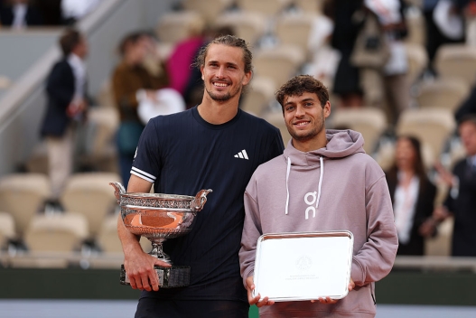  Alexander Zverev of Germany with the Coupe des Mousquetaires winners trophy alongside Flavio Cobolli of Italy and the runner's up trophy after the Men’s Singles final match on Day Fifteen of the 2026 French Open at Roland Garros on June 07, 2026 in Paris, France. (Photo by Clive Brunskill/Getty Images)