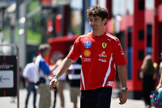 Ferrari driver Charles Leclerc of Monaco walks through the paddock ahead of the Austrian F1 Grand Prix, in Spielberg, Austria, Thursday, June 25, 2026. (AP Photo/Denes Erdos)