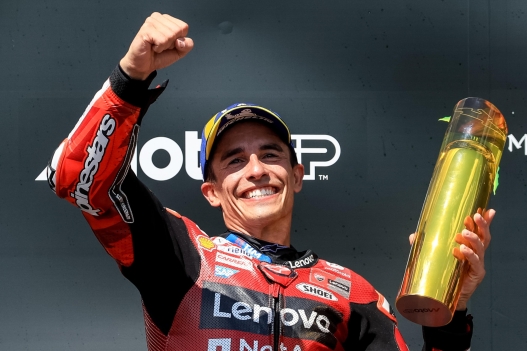 epa13054013 Spanish MotoGP rider Marc Marquez of Ducati Lenovo Team celebrates on podium after winning the Motorcycling Grand Prix of the Czech Republic at the Masaryk Circuit in Brno, Czech Republic, 21 June 2026.  EPA/MARTIN DIVISEK