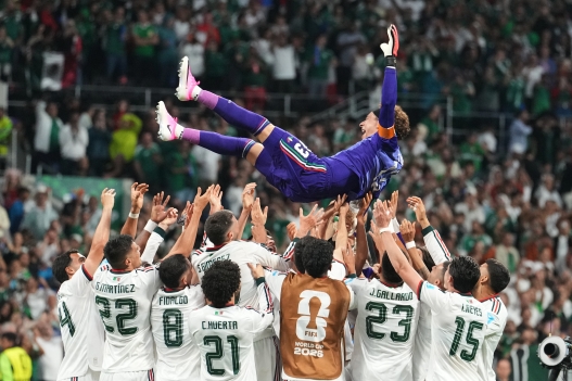 Mexico goalkeeper Guillermo Ochoa, top, celebrates with teammates following the World Cup Group A soccer match between Czechia and Mexico in Mexico City, Wednesday, June 24, 2026. (AP Photo/Fernando Llano)