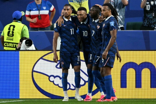 France's forward #07 Ousmane Dembele celebrates scoring his team's third goal with teammates forward #11 Michael Olise, forward #10 Kylian Mbappe, and defender #05 Jules Kounde during the 2026 World Cup Group I football match between France and Iraq at the Philadelphia Stadium in Philadelphia on June 22, 2026.  (Photo by MAURO PIMENTEL / AFP)