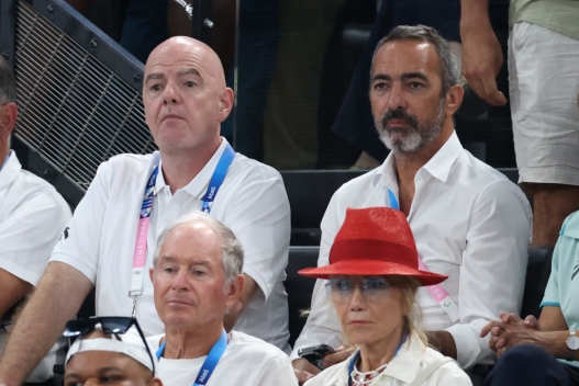   FIFA President Gianni Infantino and Youri Djorkaeff attend the Artistic Gymnastics Women's Team Final on day four of the Olympic Games Paris 2024 at Bercy Arena on July 30, 2024 in Paris, France.  (Photo by Pascal Le Segretain/Getty Images)