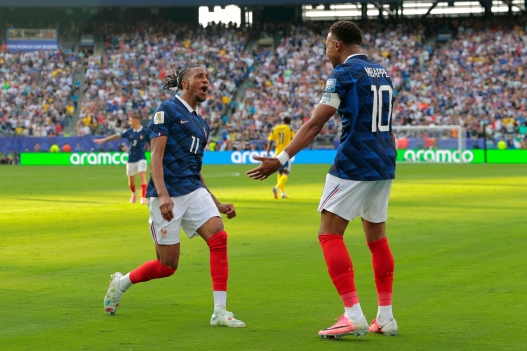 France's Kylian Mbappe (10) celebrates scoring their third goal with Michael Olise (11) during the World Cup round of 32 soccer match between France and Sweden in East Rutherford, N.J., near New York, Tuesday, June 30, 2026. (AP Photo/Pamela Smith)