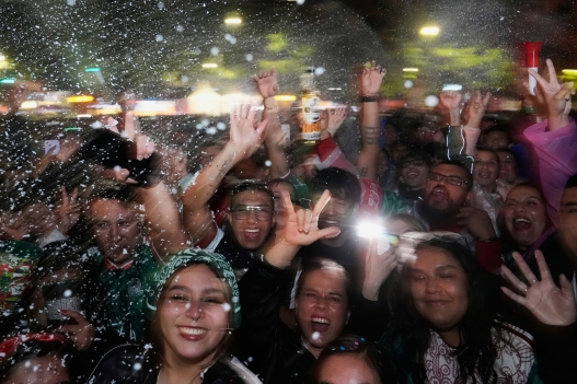 Fans celebrate on Reforma Ave., near the Angel of Independence monument in Mexico City, after Mexico's Julian Quinones scored against Ecuador during the World Cup round of 32 soccer match, Tuesday, June 30, 2026. (AP Photo/Marco Ugarte)