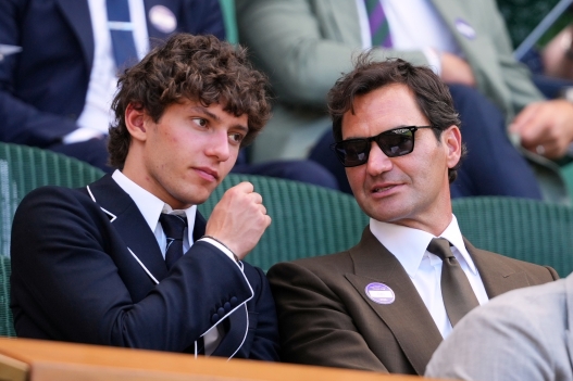 F1 Mercedes driver Andrea Kimi Antonelli of Italy sits beside former tennis player Roger Federer of Switzerland in the Royal Box on day eight at the Wimbledon Tennis Championships in London, Monday, July 6, 2026.(AP Photo/Kirsty Wigglesworth)