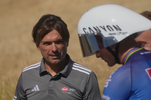 Alpecin team manager Christoph Roodhooft, left, talks to Netherlands' Mathieu Van Der Poel during a training one day ahead of the start of the Tour de France Cycling race, outside Barcelona, Spain, Friday, July 3, 2026. (AP Photo/Thibault Camus)