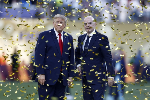 epa13121950 US President Donald J. Trump (L) and FIFA President Gianni Infantino (R) stand under confetti as players of Spain (out of picture) celebrate with the World Cup Trophy after the FIFA World Cup 2026 final match Spain against Argentina, in East Rutherford, New Jersey, USA, 19 July 2026.  EPA/WILL OLIVER